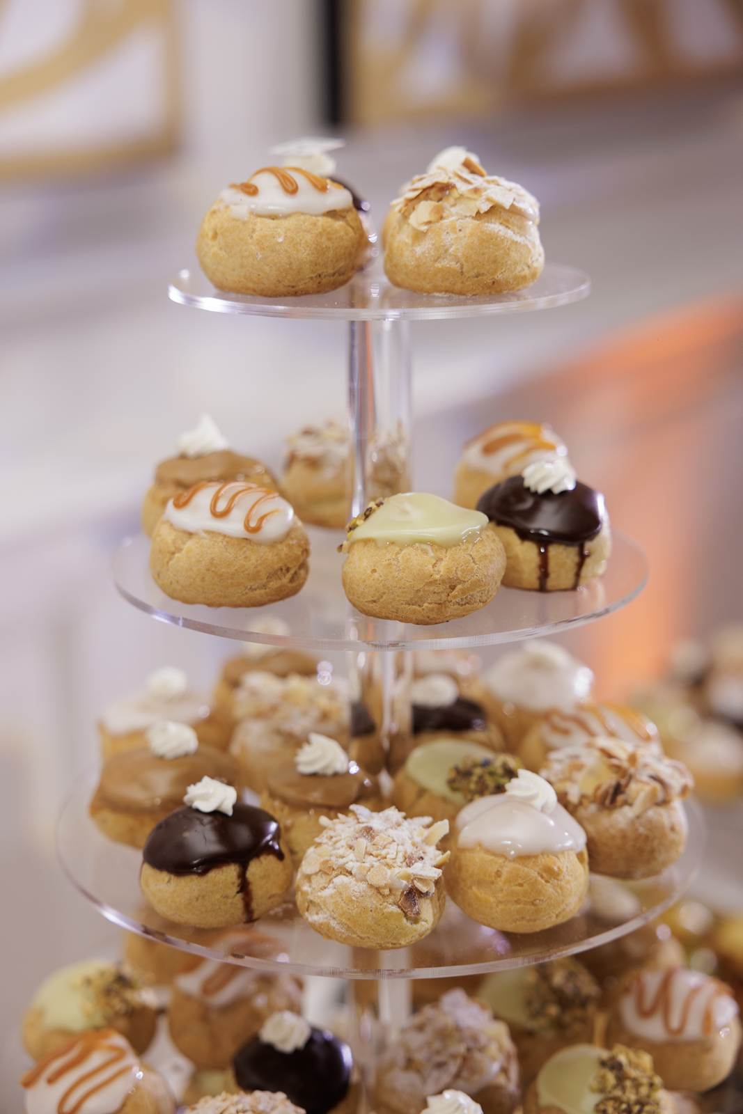 A tiered stand of choux glazed with caramel, chocolate and almonds